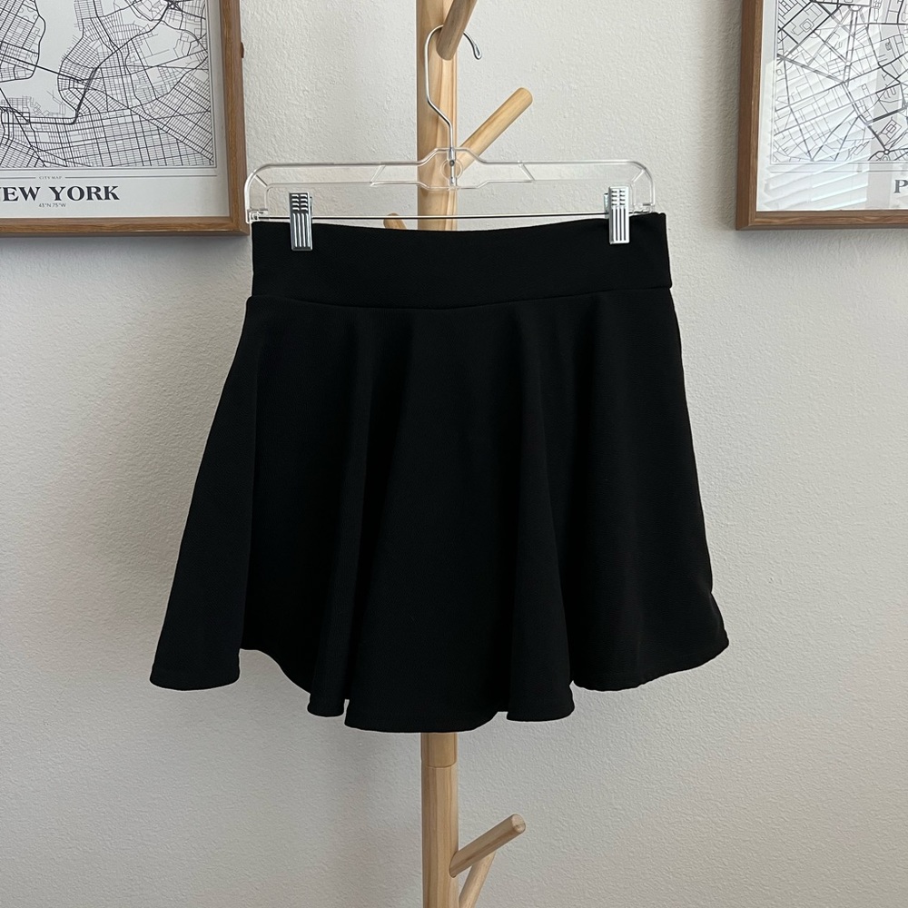 Black high waisted skirt with built in shorts.